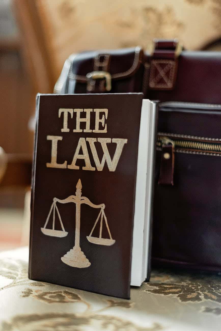 law book next to a suitcase